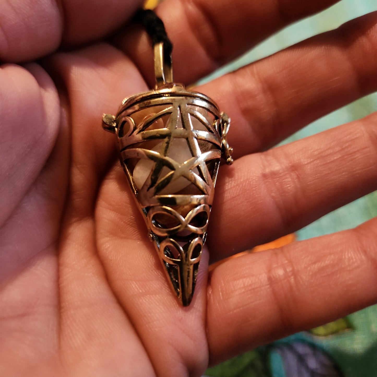 gold tone chip cage pendulum