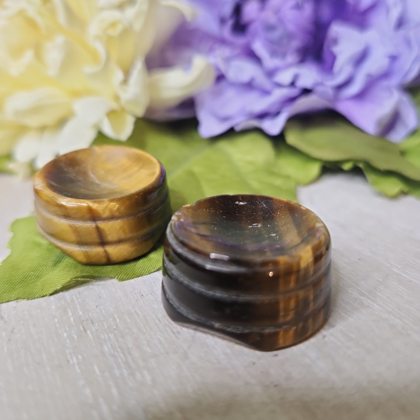 Tiger eye sphere holder carving