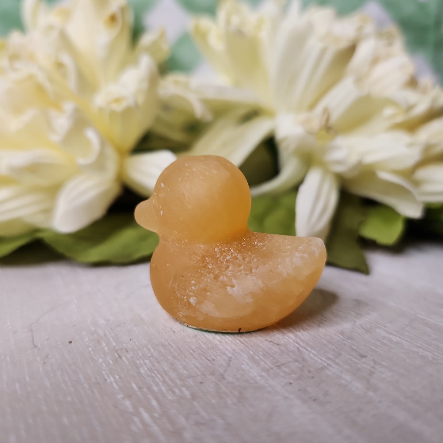 Orange calcite duck carving