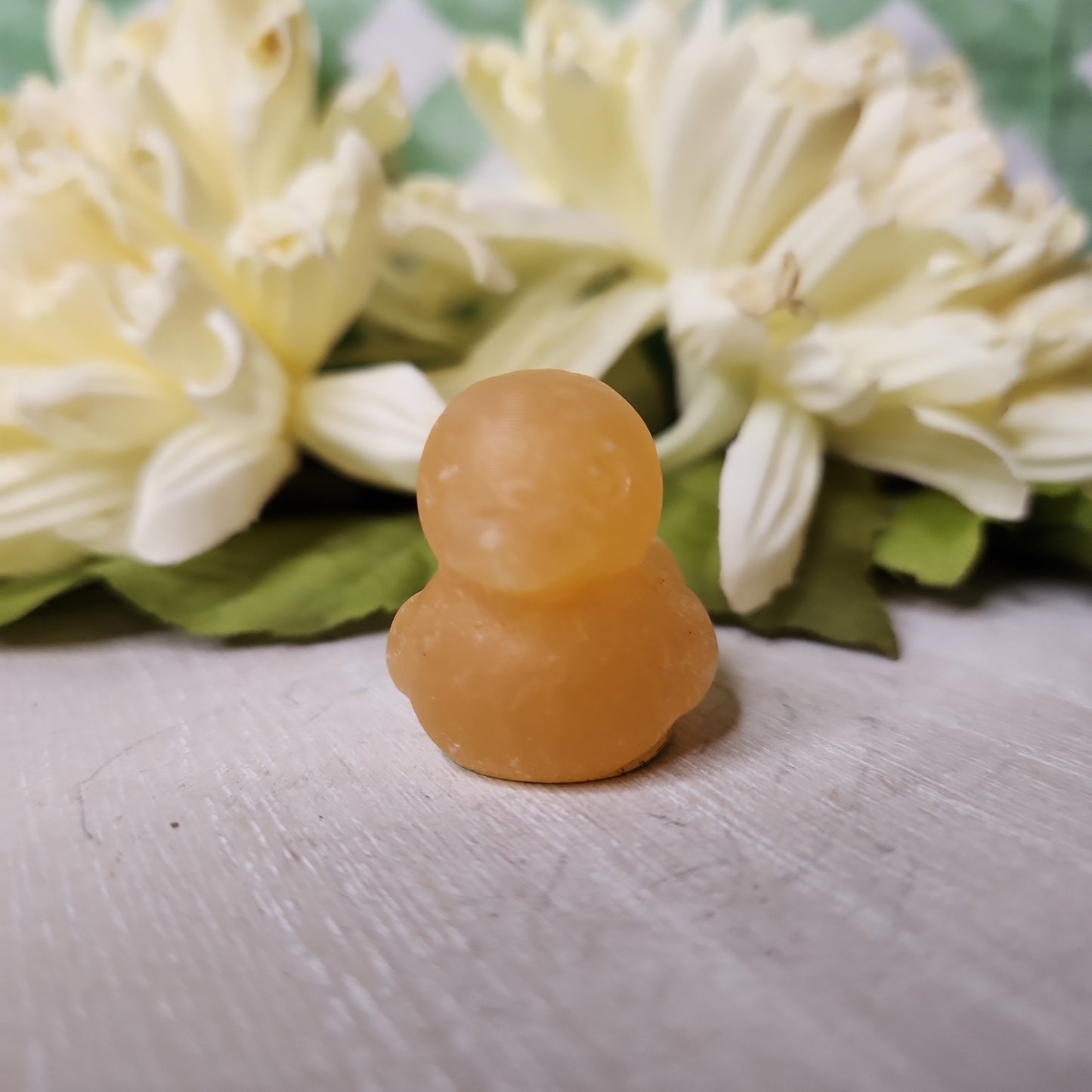 Orange calcite duck carving
