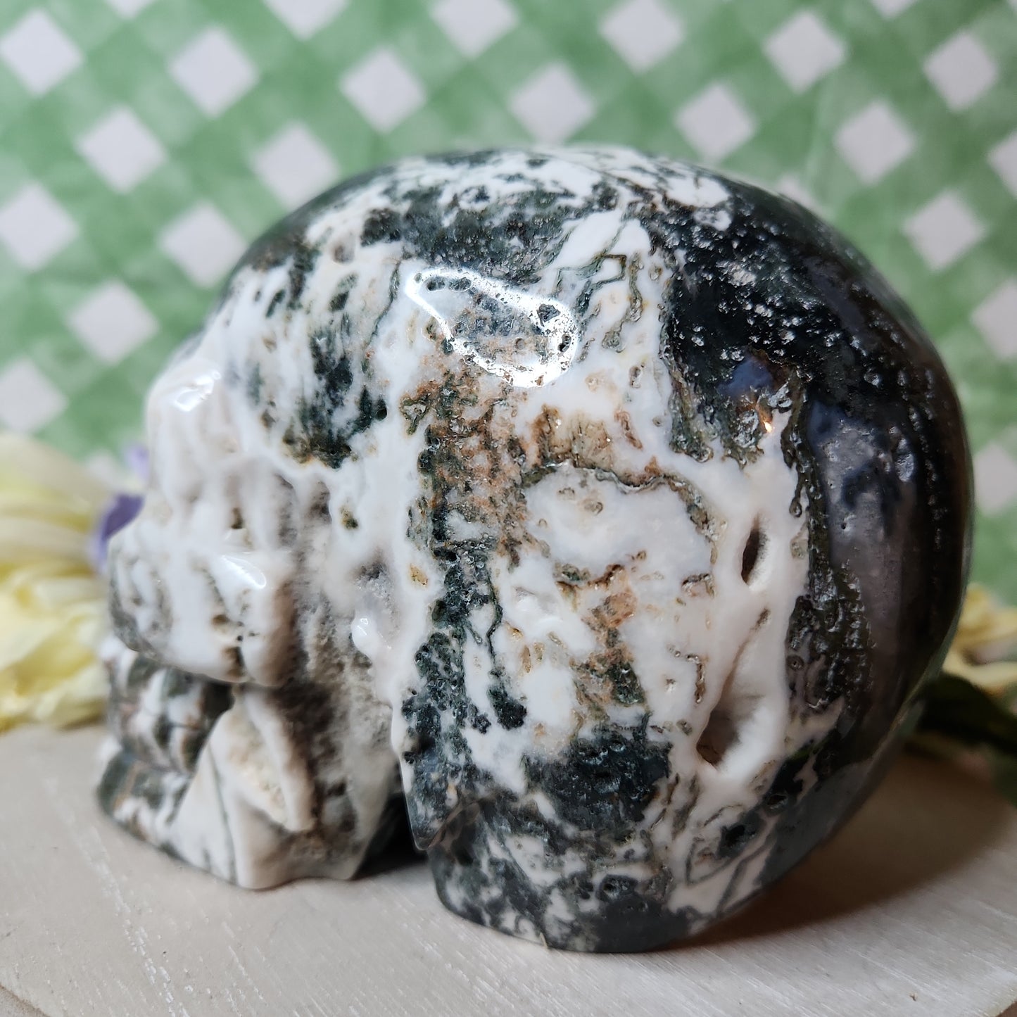 Statement moss agate skull carving
