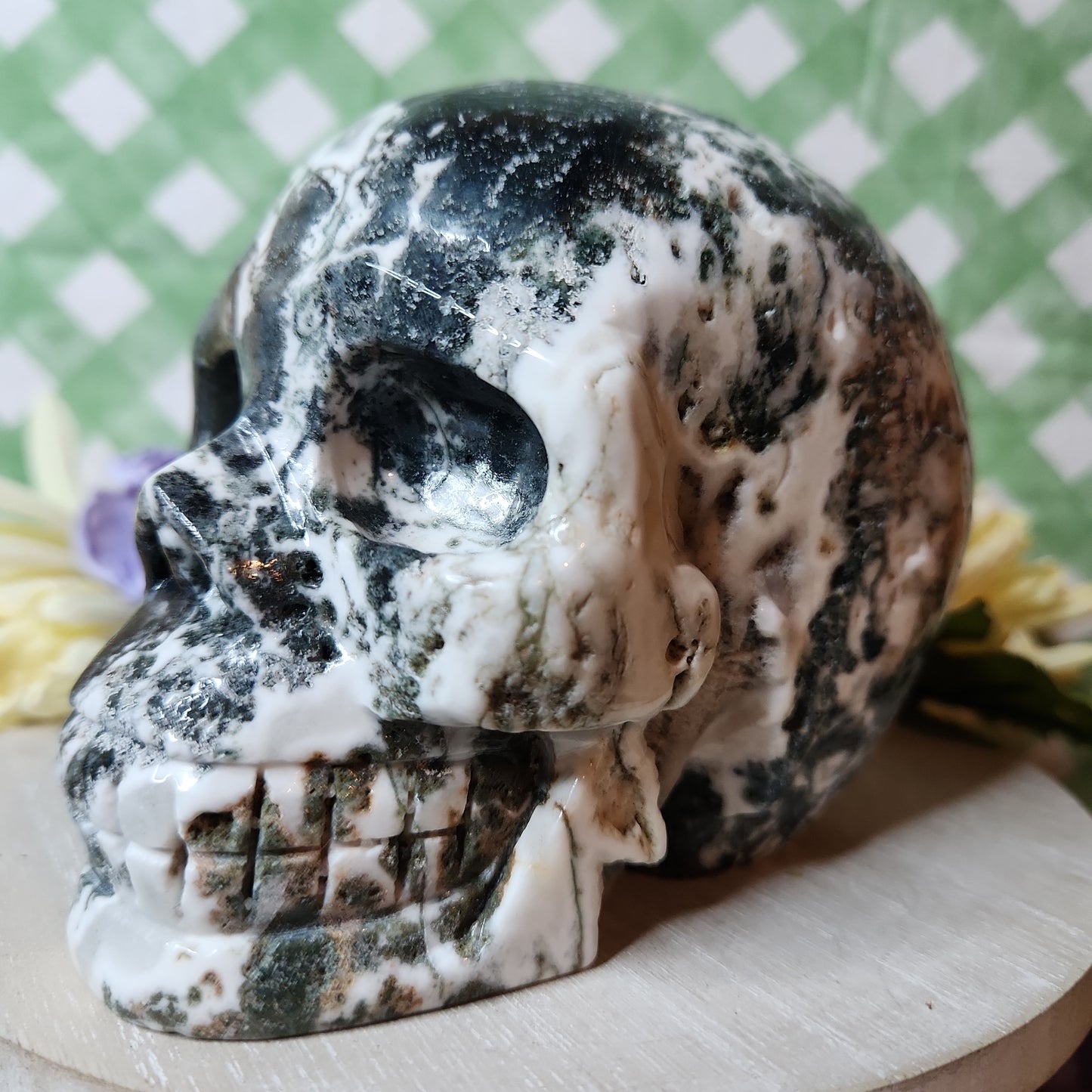Statement moss agate skull carving