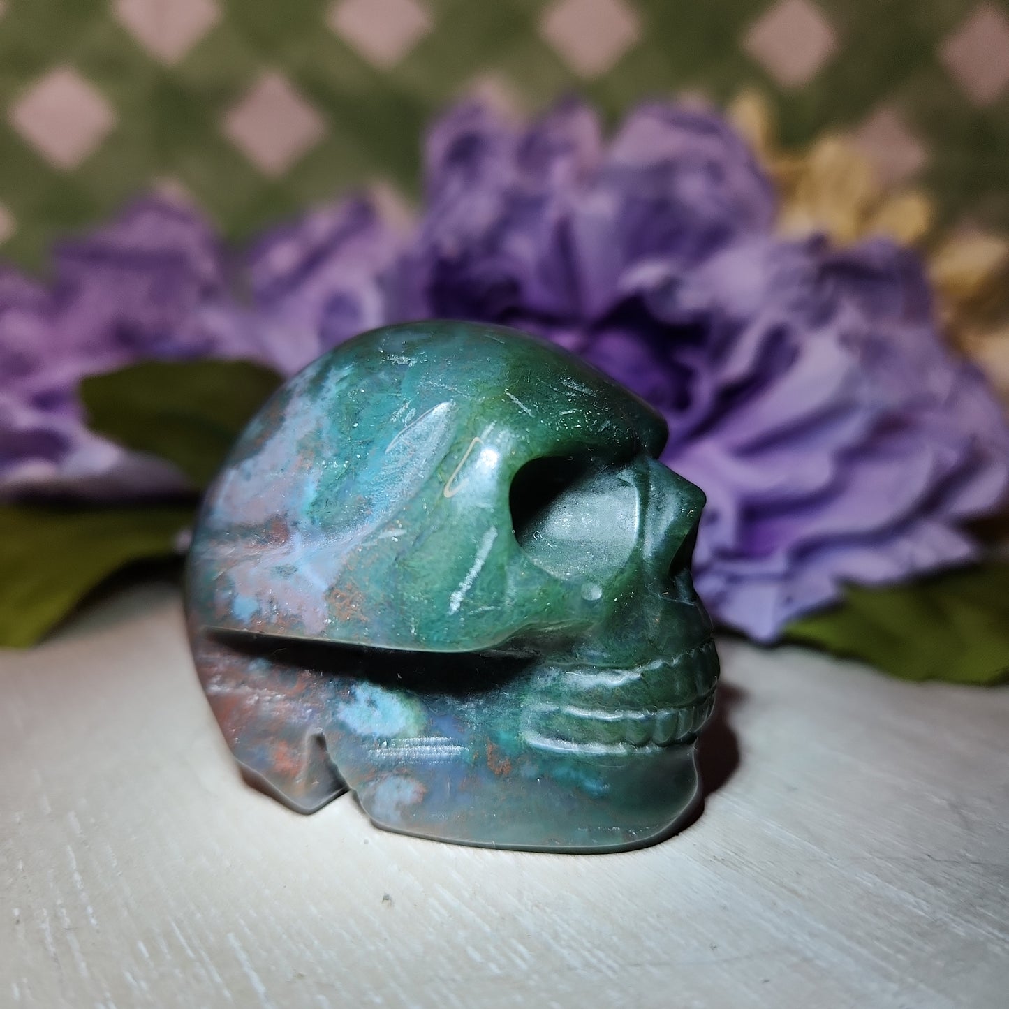 Moss agate skull carving (a)