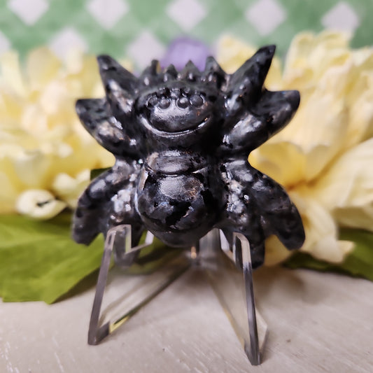 Larvikite spider carving